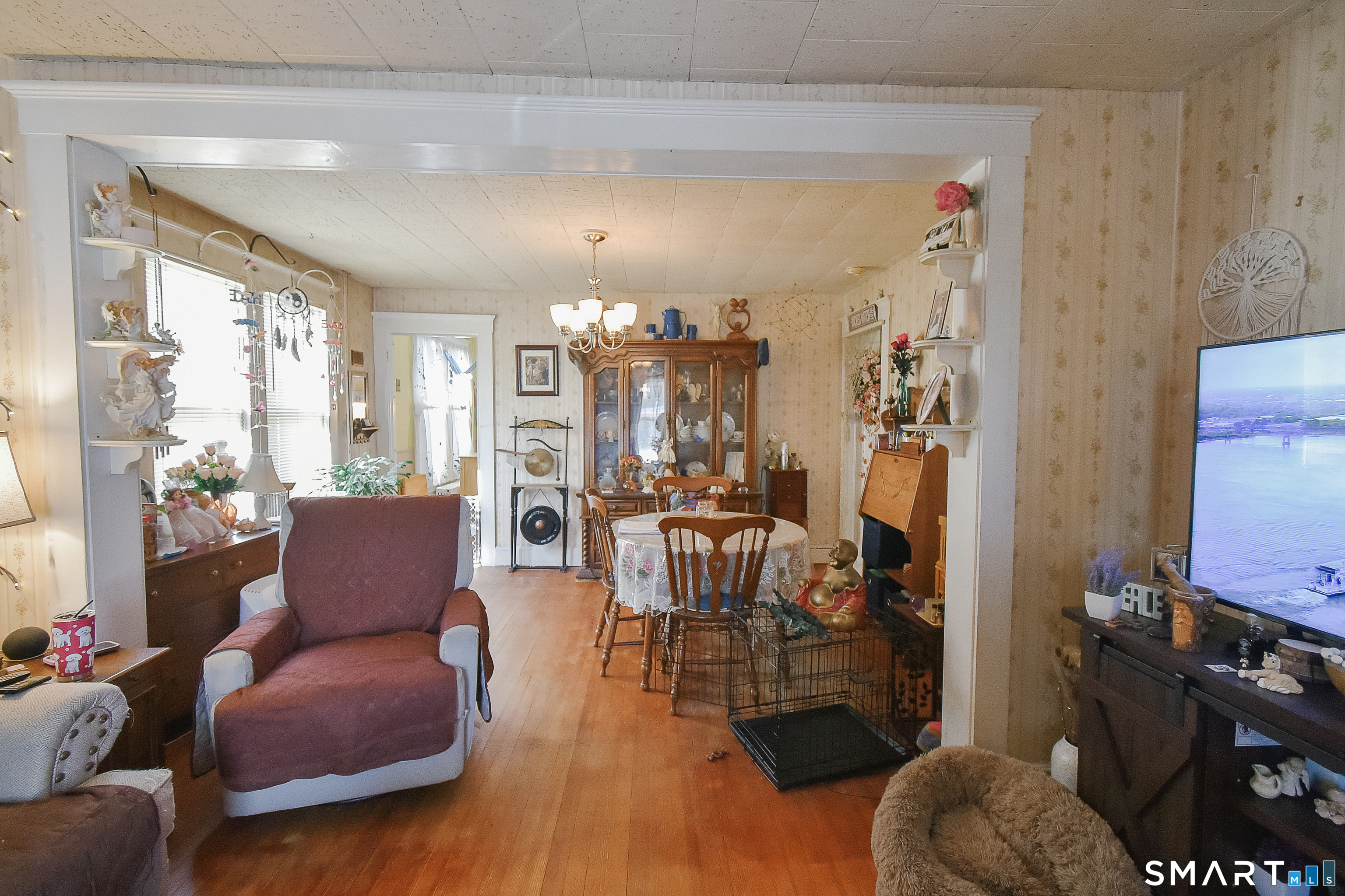 35 School Street Torrington, CT 06790 - Photo 4 of 17 a living room with furniture and wooden floor