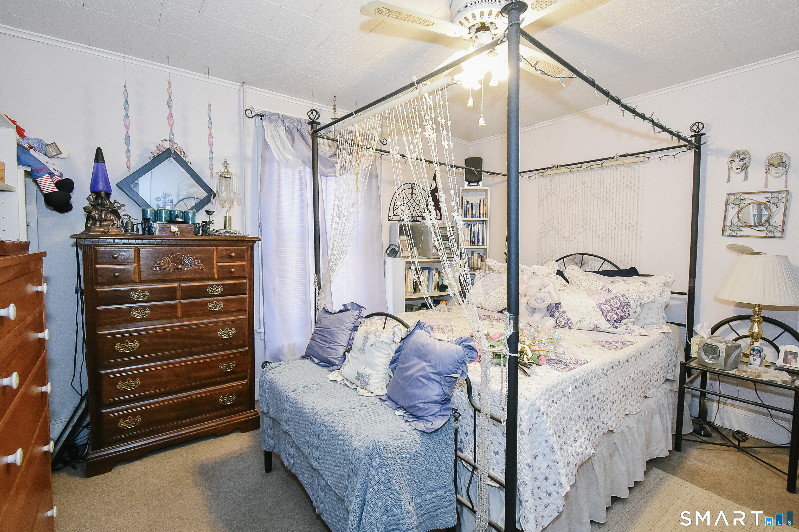 35 School Street Torrington, CT 06790 - Photo 6 of 17 a bedroom with furniture and a wooden floor