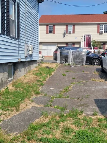 a swimming pool with outdoor seating and yard