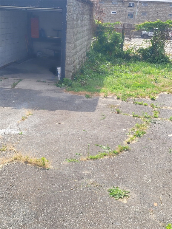 90 Tremont Street Fall River, MA 02720 - Photo 4 of 16 a view of a yard with porch