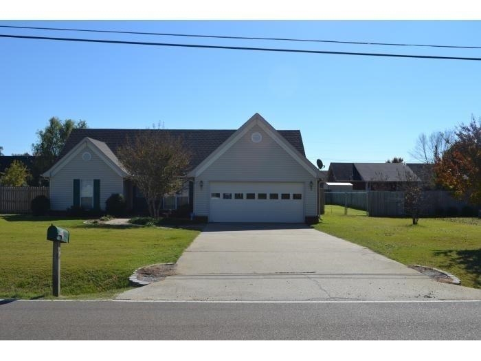3078 Meade Lake Road Atoka, TN 38004 - Photo 1 of 8 View of front of property featuring concrete driveway and a garage