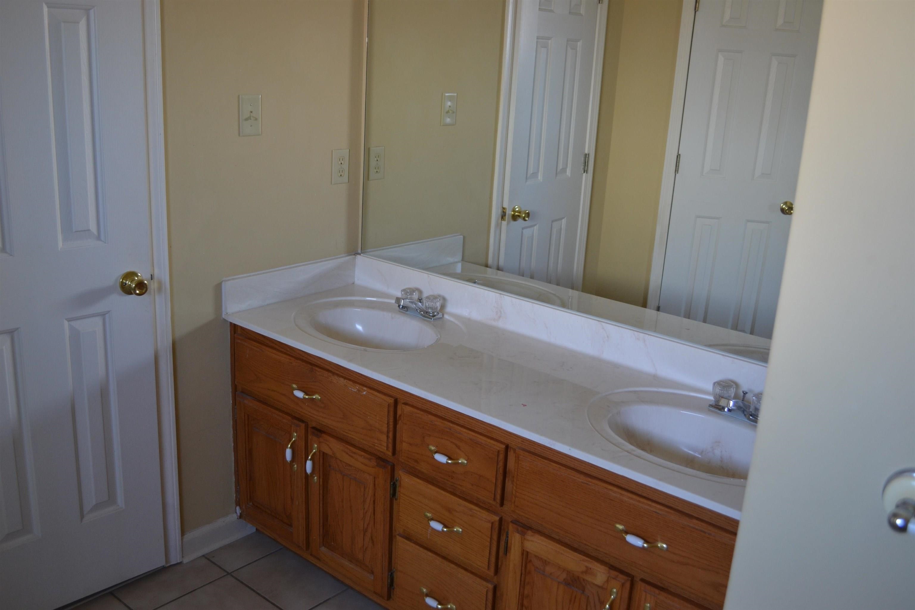 3078 Meade Lake Road Atoka, TN 38004 - Photo 7 of 8 Full bath with double vanity and light tile patterned floors