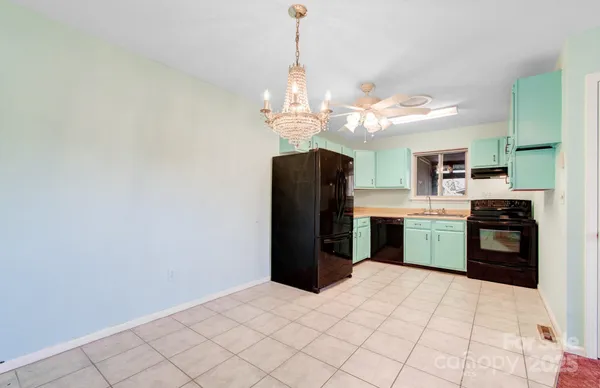 a view of a chandelier in an empty room