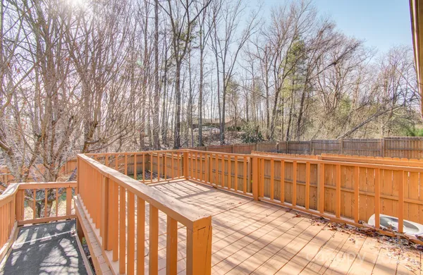 a view of a balcony with wooden floor