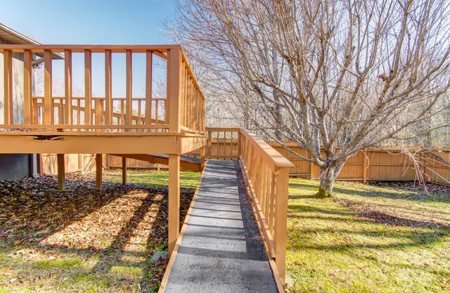 a view of a house with swimming pool in front of it