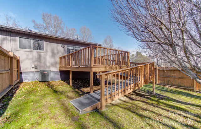 a view of a house with swimming pool in front of main door