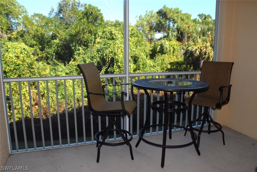 8251 Pathfinder Loop, Unit 624 Fort Myers, FL 33919 - Photo 13 of 15 a view of a balcony with chairs