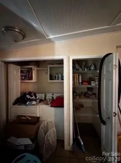 a kitchen with a refrigerator and a stove