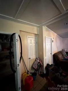 a room with lots of trees and furniture