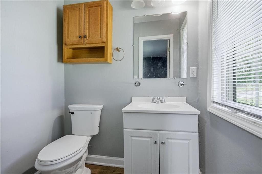 2536 Butner Road Atlanta, GA 30331 - Photo 17 of 42 a bathroom with a toilet sink and mirror