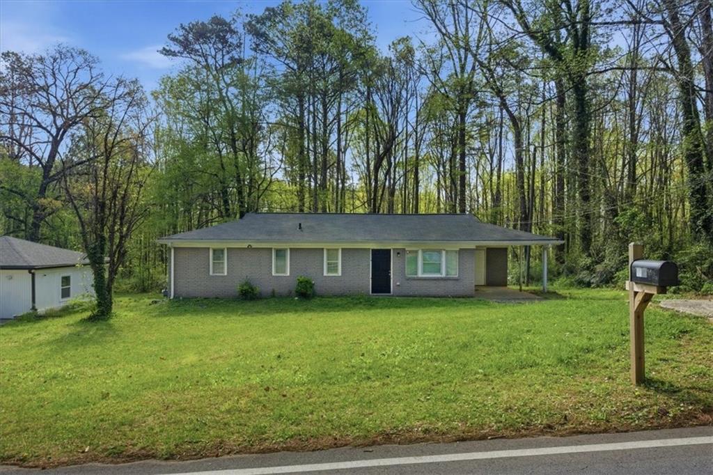 2536 Butner Road Atlanta, GA 30331 - Photo 2 of 42 front view of a house with a yard
