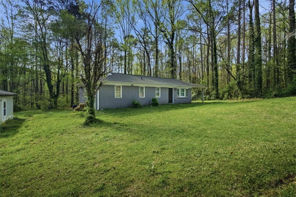 2536 Butner Road Atlanta, GA 30331 - Photo 22 of 42 a view of house with yard and outdoor seating