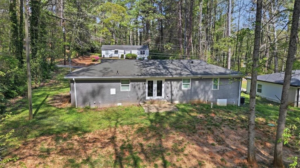 2536 Butner Road Atlanta, GA 30331 - Photo 33 of 42 a view of a wooden house with a yard