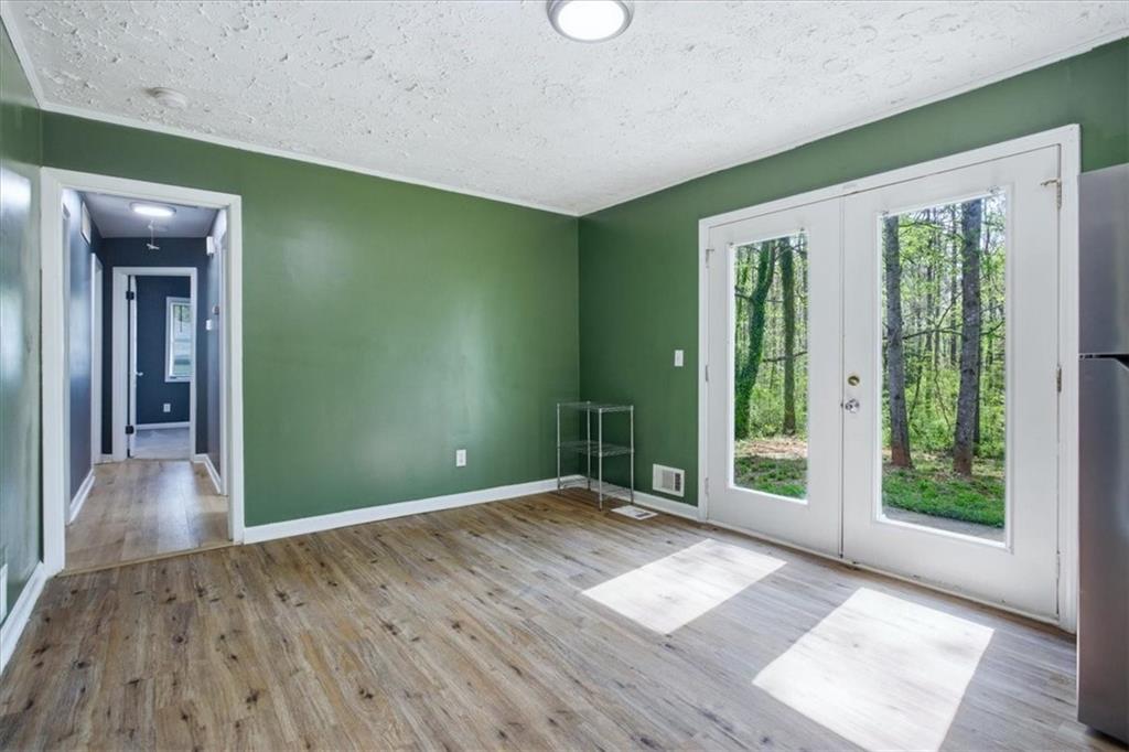2536 Butner Road Atlanta, GA 30331 - Photo 8 of 42 wooden floor in an empty room with a window