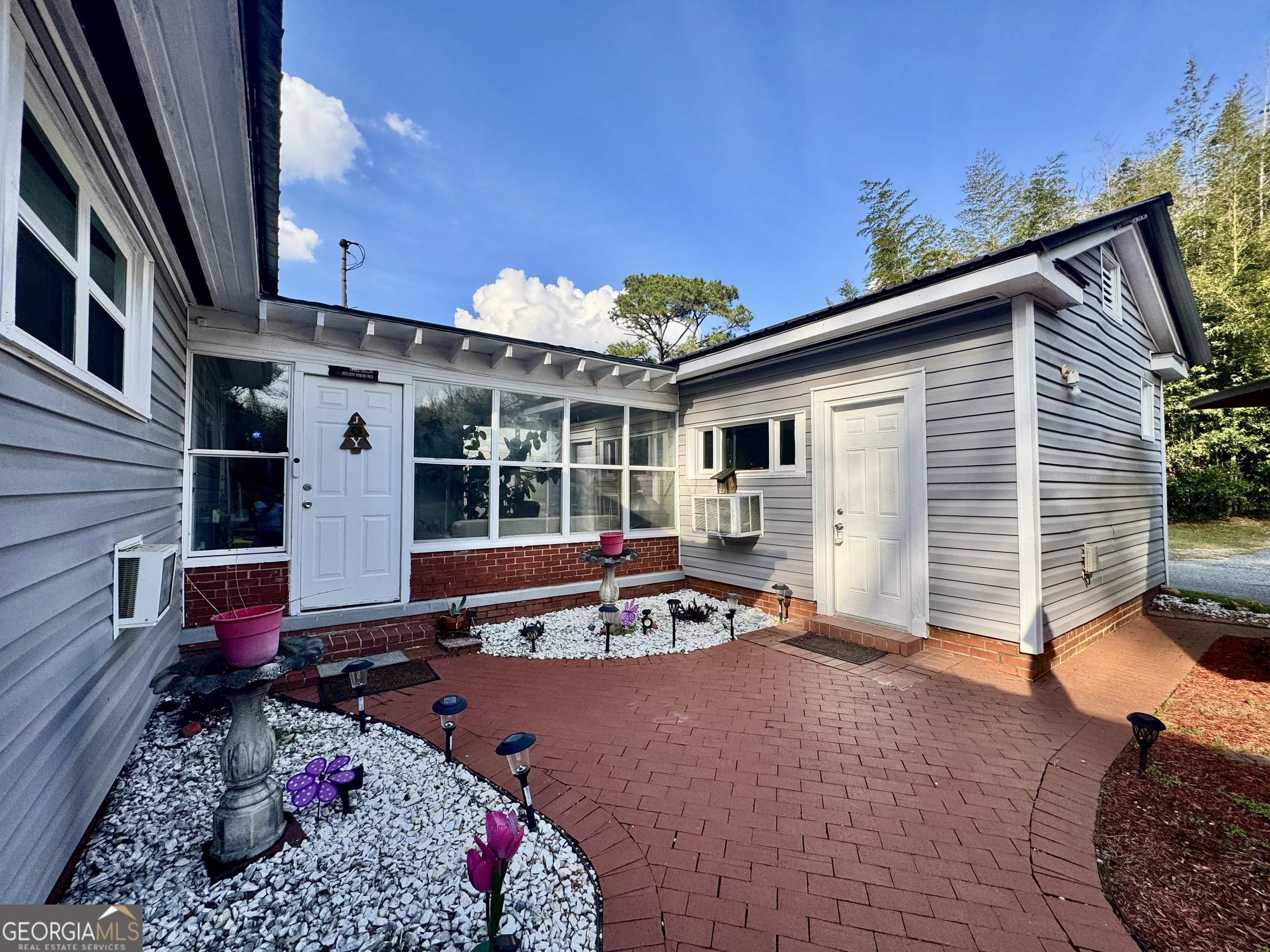 914 Adderton Street Americus, GA 31719 - Photo 13 of 54 a view of a house with a patio