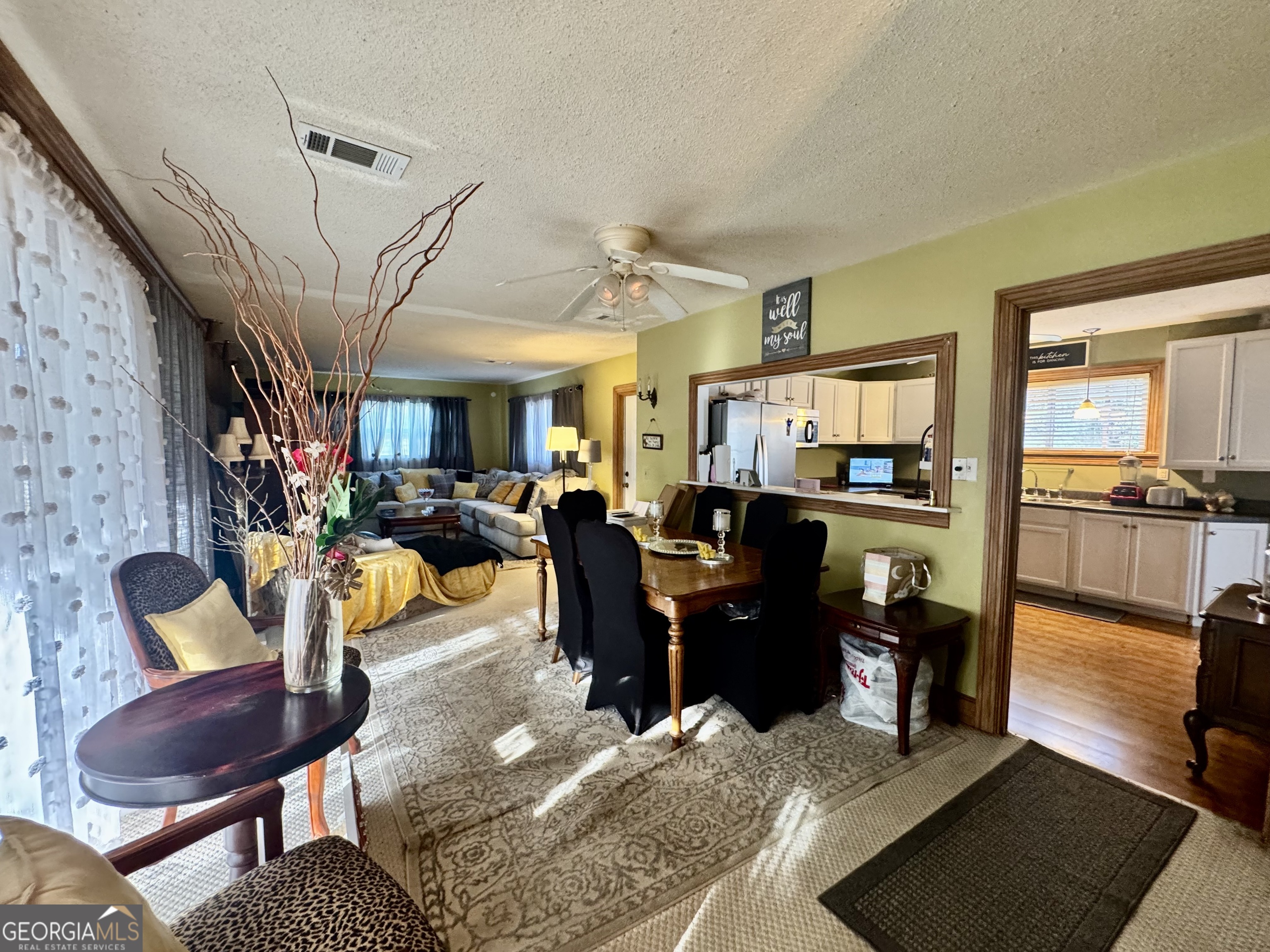 914 Adderton Street Americus, GA 31719 - Photo 16 of 54 a living room with furniture dining area and a flat screen tv