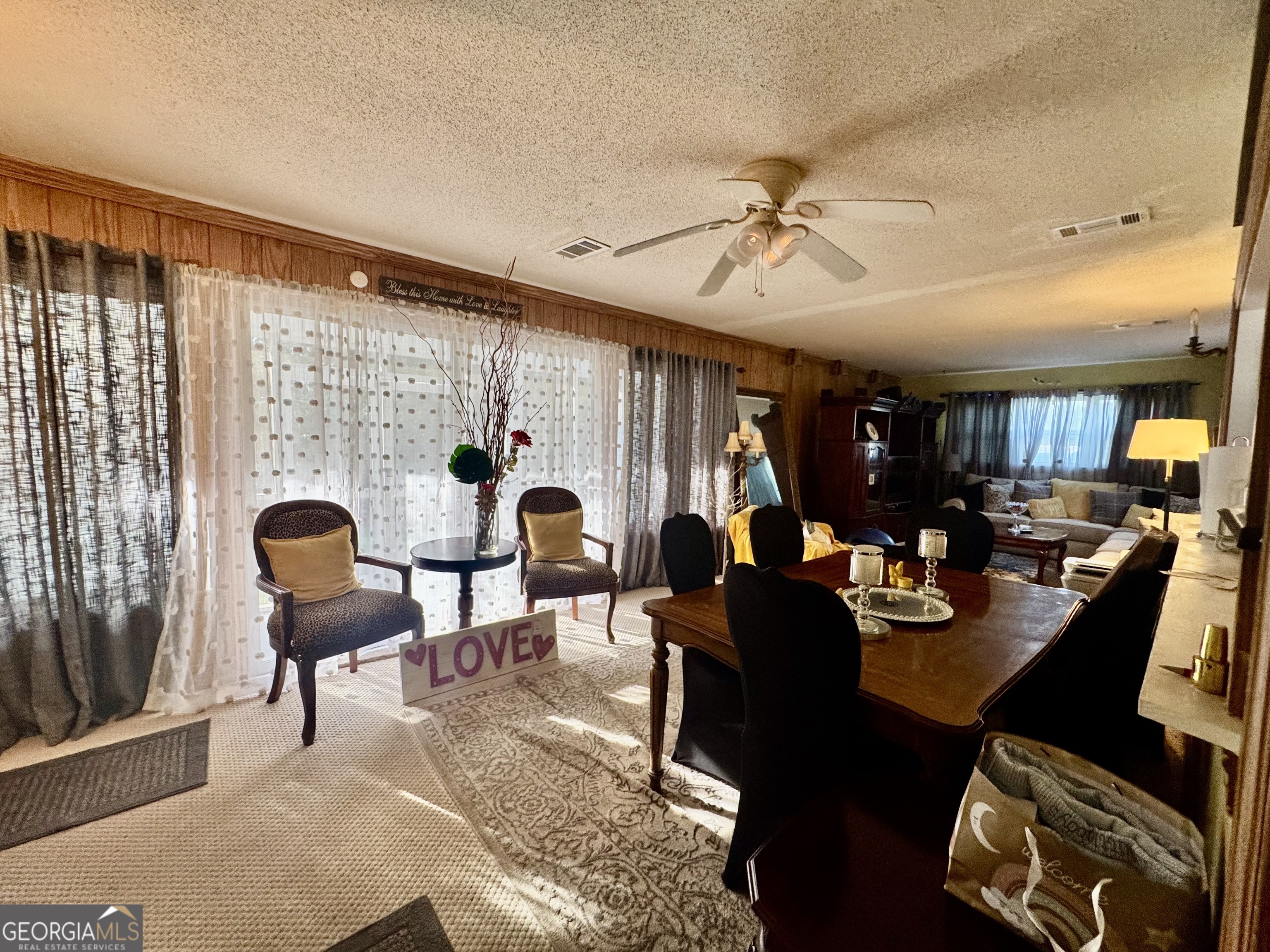 914 Adderton Street Americus, GA 31719 - Photo 17 of 54 a living room with furniture and a large window
