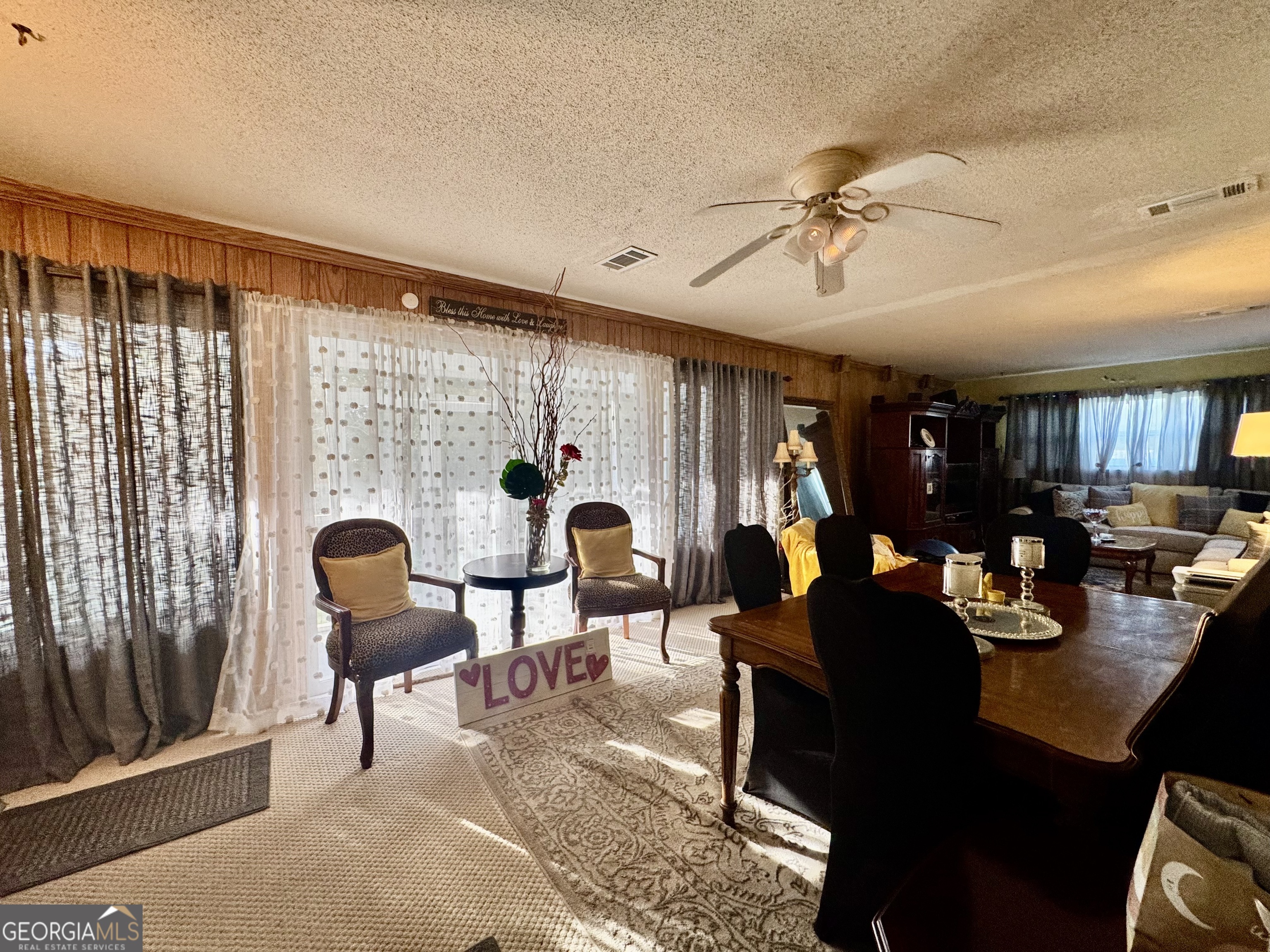 914 Adderton Street Americus, GA 31719 - Photo 18 of 54 a living room with furniture and a large window