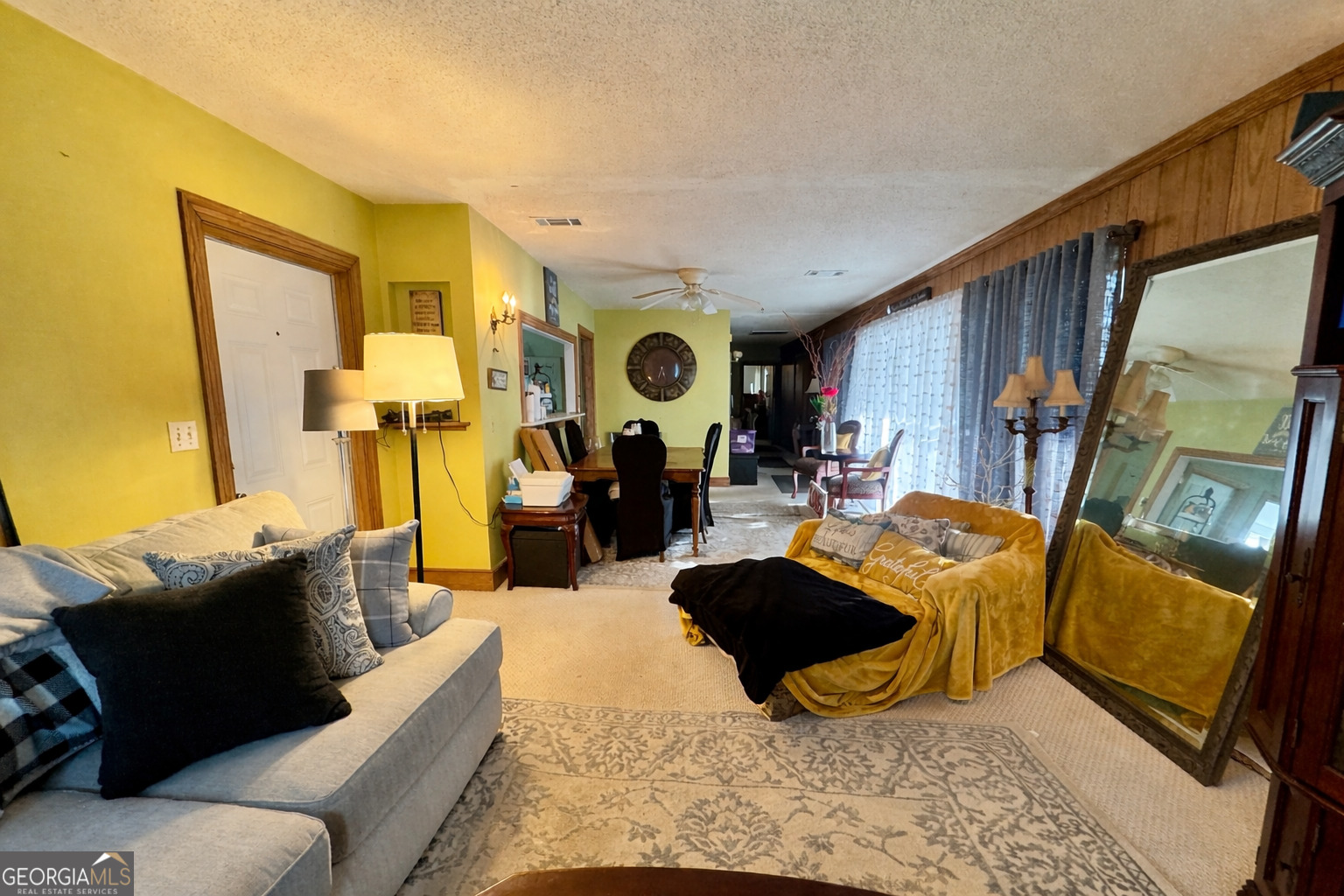914 Adderton Street Americus, GA 31719 - Photo 2 of 54 a living room with furniture and a flat screen tv