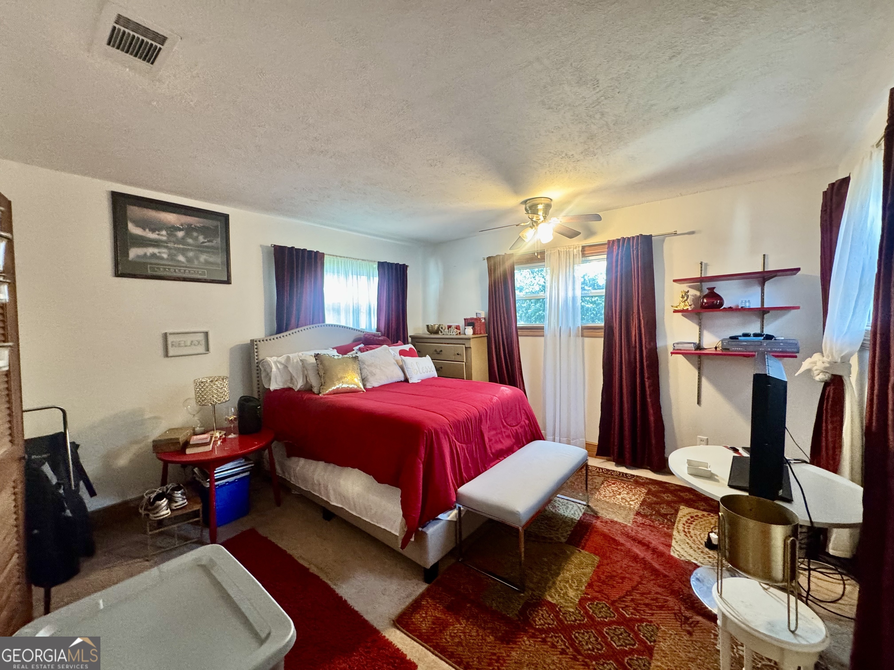 914 Adderton Street Americus, GA 31719 - Photo 24 of 54 a bed room with a bed and a flat screen tv