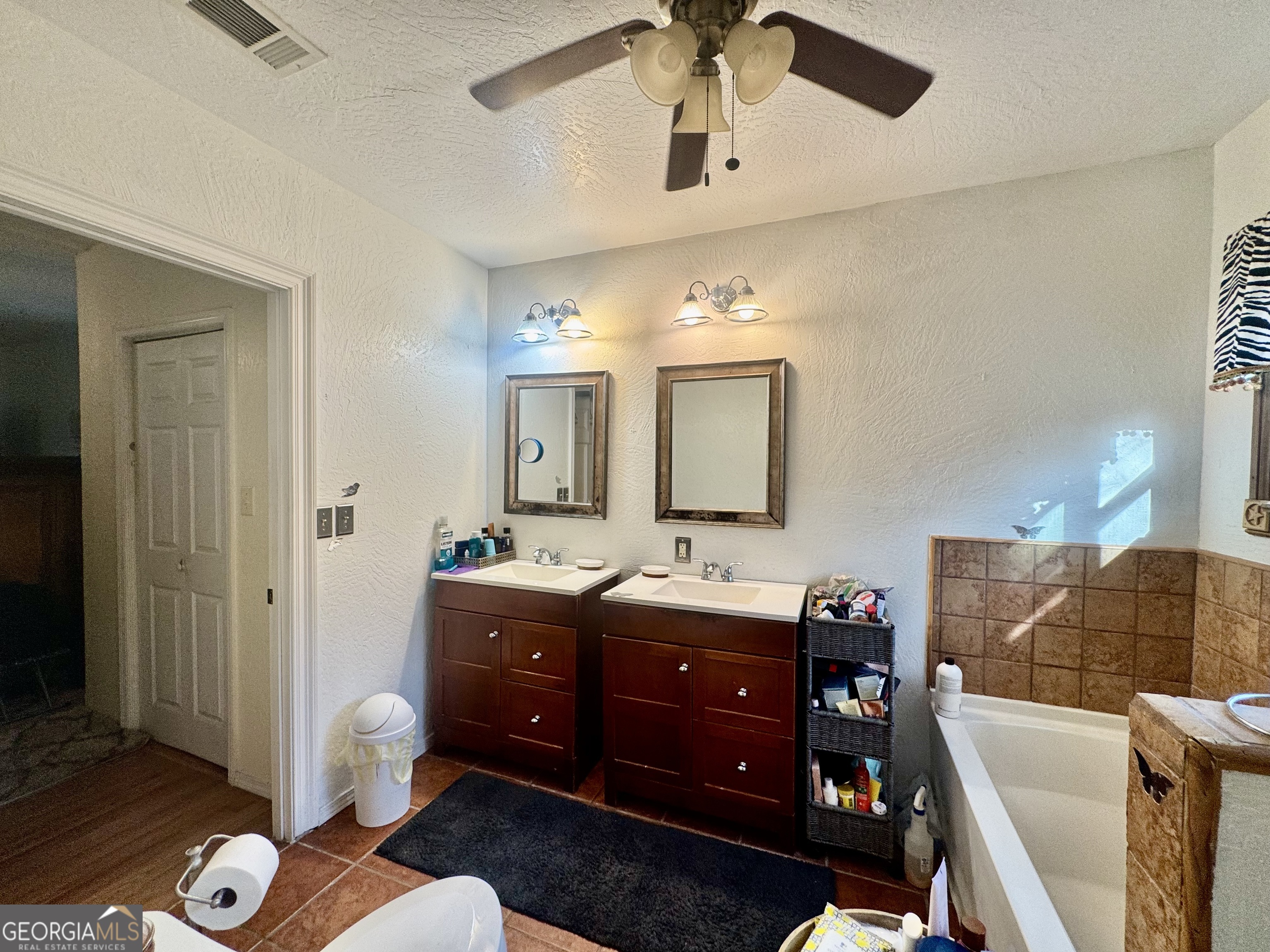 914 Adderton Street Americus, GA 31719 - Photo 32 of 54 a living room with furniture and a wooden floor