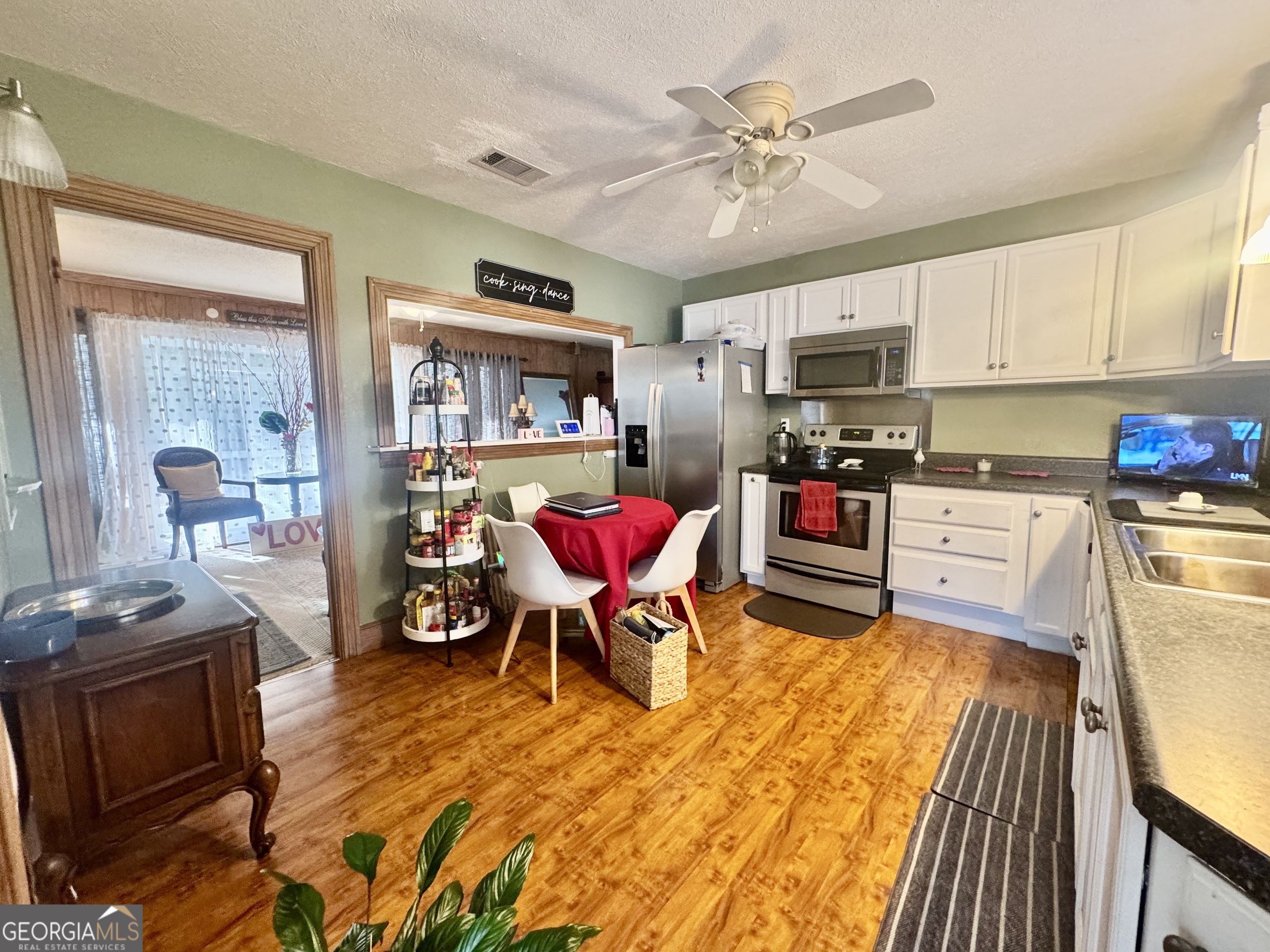 914 Adderton Street Americus, GA 31719 - Photo 35 of 54 a living room with stainless steel appliances furniture and a kitchen view