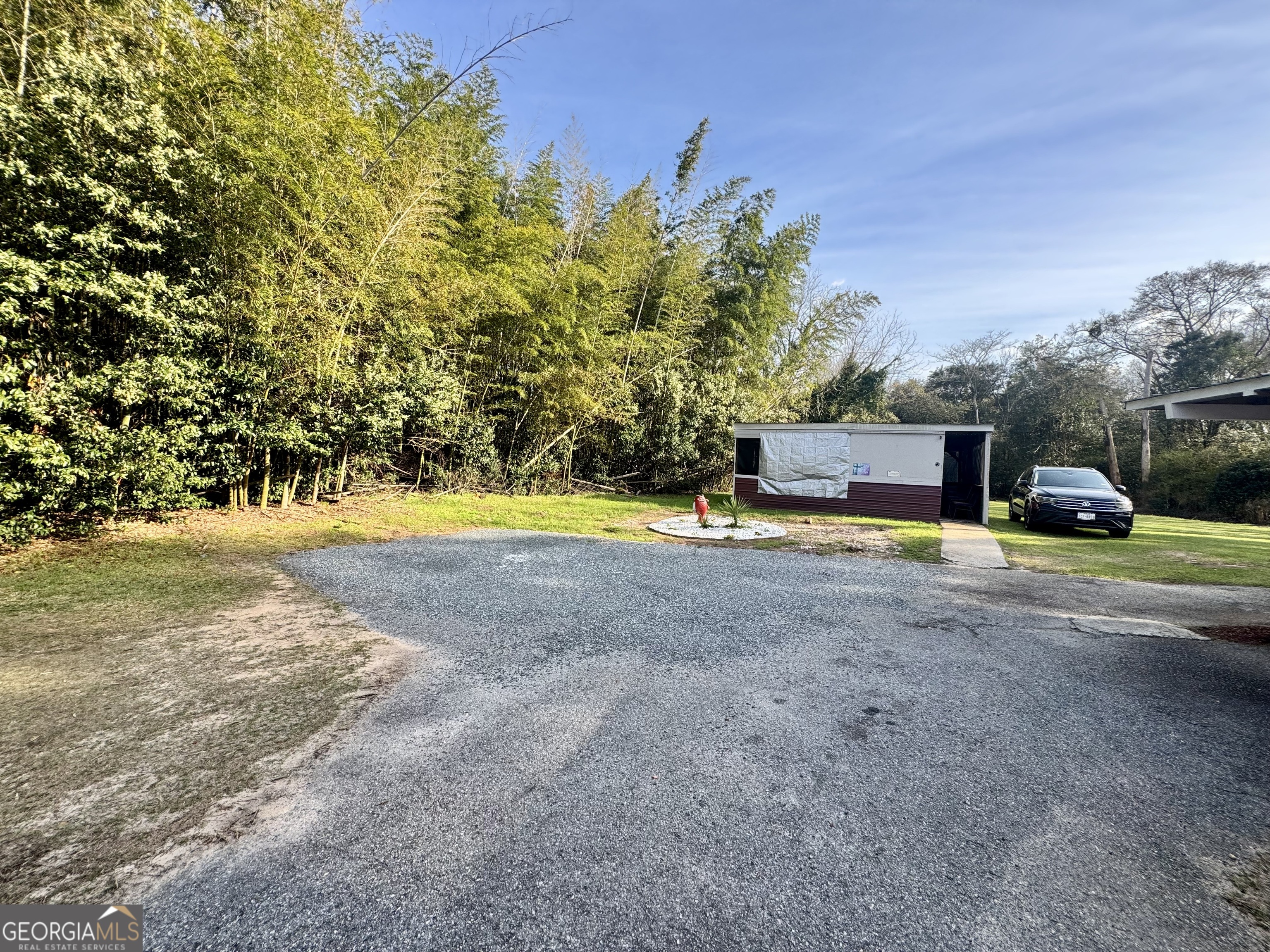914 Adderton Street Americus, GA 31719 - Photo 4 of 54 a view of a park with large trees
