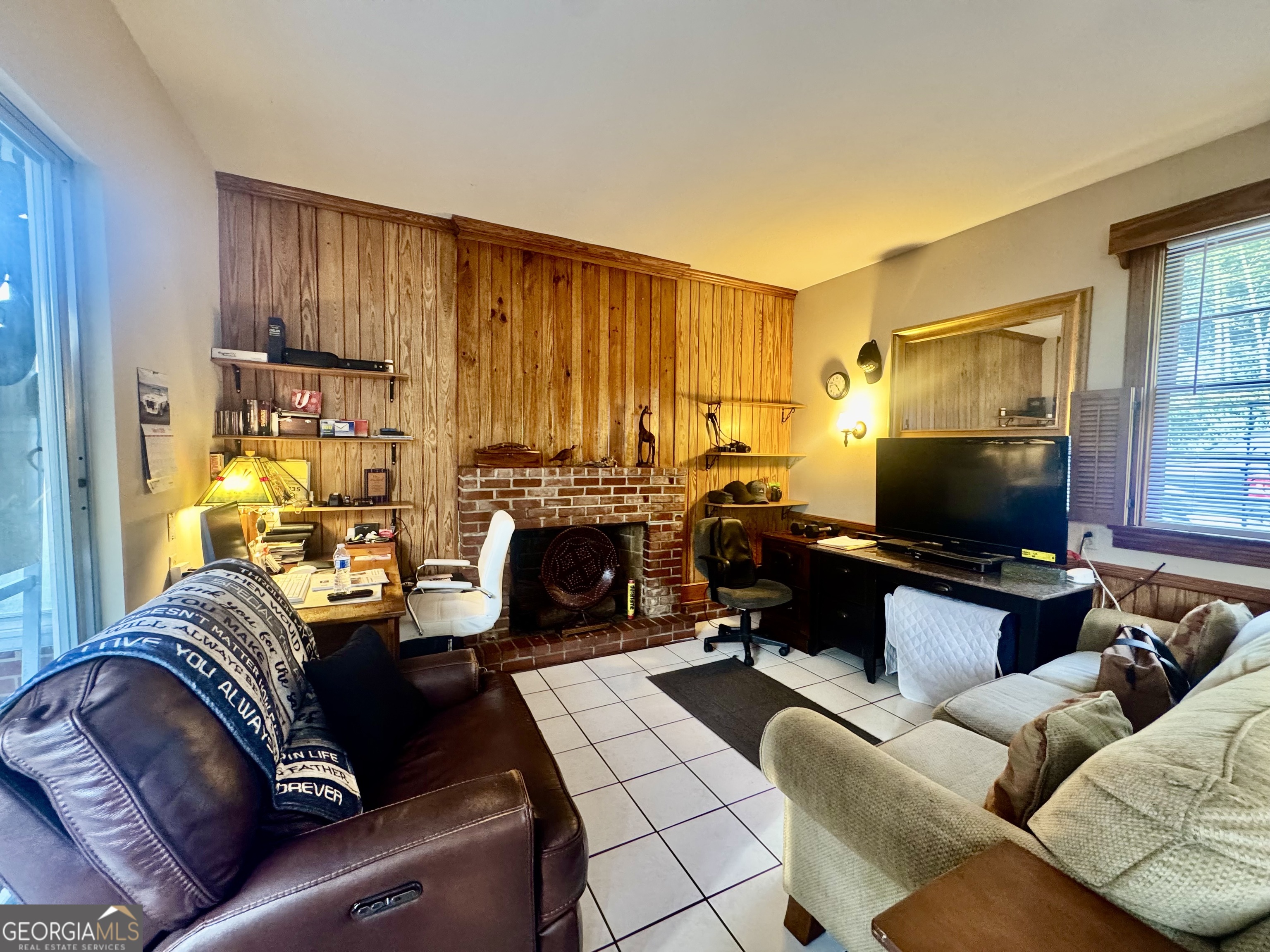 914 Adderton Street Americus, GA 31719 - Photo 42 of 54 a living room with furniture a couch and a flat screen tv