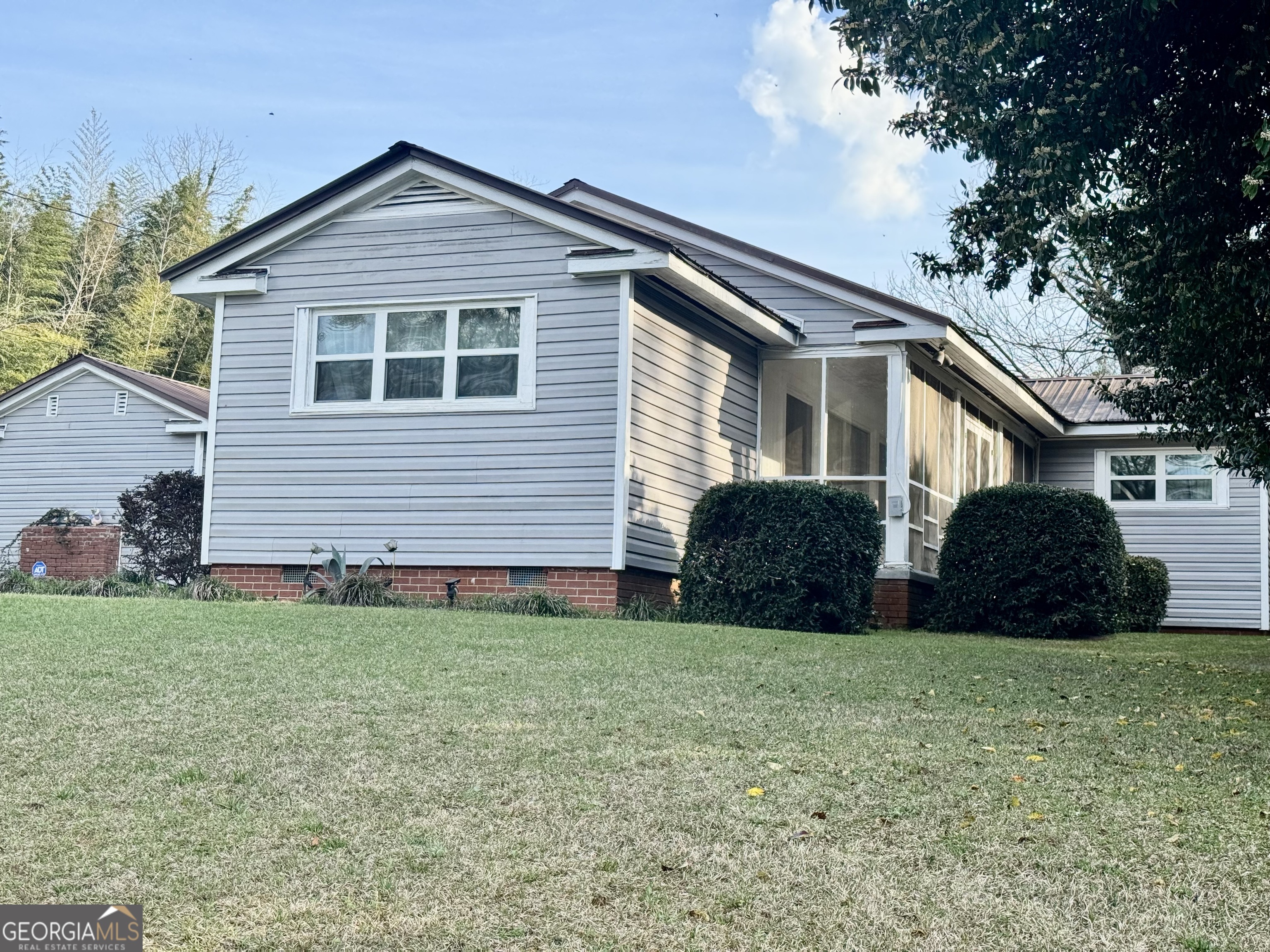 914 Adderton Street Americus, GA 31719 - Photo 5 of 54 a front view of a house with a yard