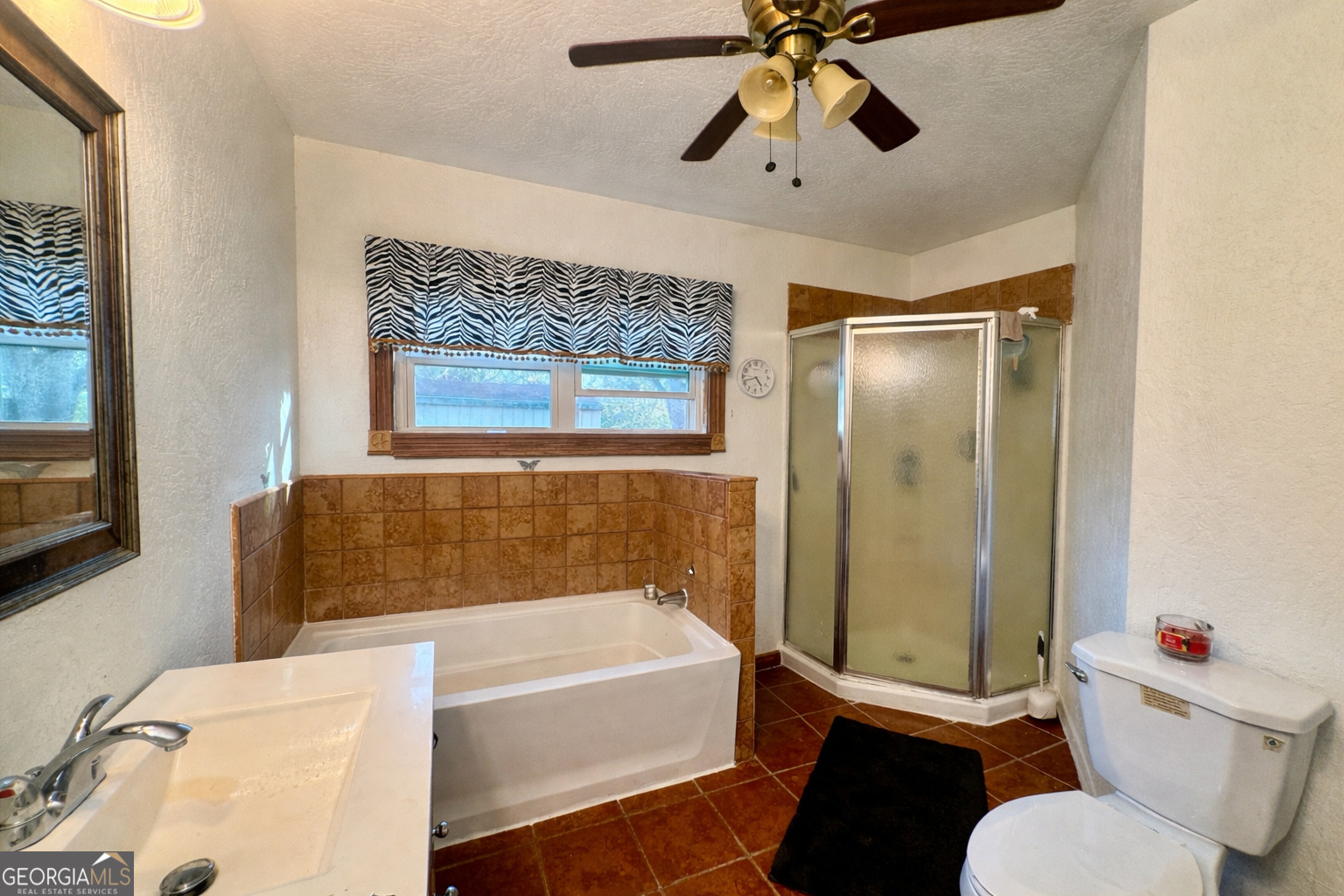 914 Adderton Street Americus, GA 31719 - Photo 51 of 54 a bathroom with a tub toilet and sink