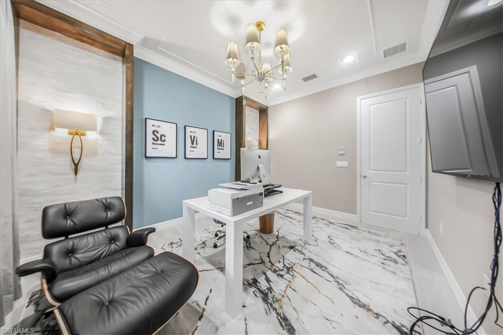 4036 Nova Lane Naples, FL 34119 - Photo 10 of 50 a living room with furniture and a chandelier
