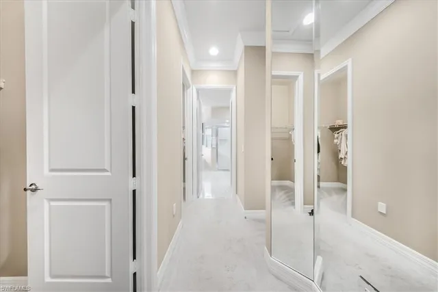 a bedroom with a large bed and a flat tv screen on dresser