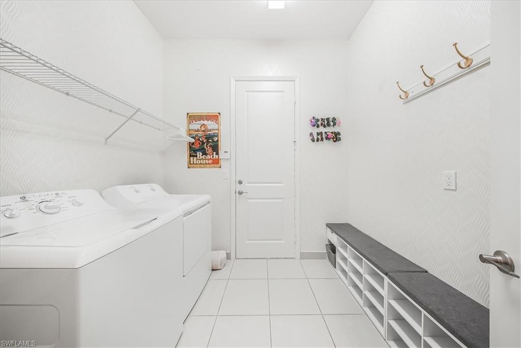 4036 Nova Lane Naples, FL 34119 - Photo 33 of 50 a utility room with dryer and washer