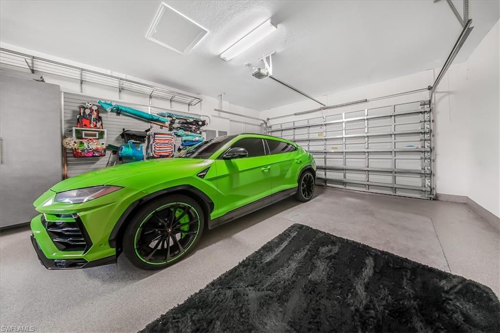4036 Nova Lane Naples, FL 34119 - Photo 35 of 50 a green car parked in a garage