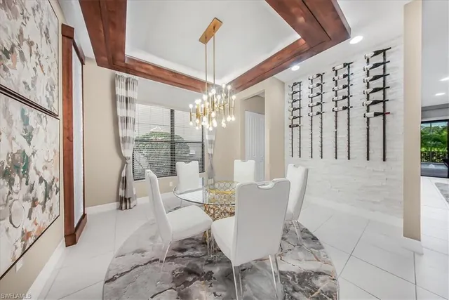 a view of a dining room with furniture wooden floor and chandelier