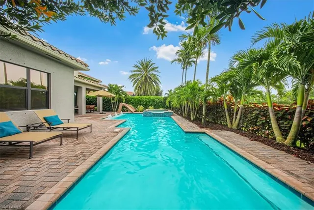 a green car parked in a garage