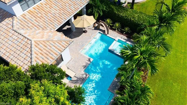 a view of a patio with chairs and plants