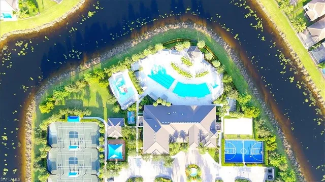 a view of a backyard patio and swimming pool