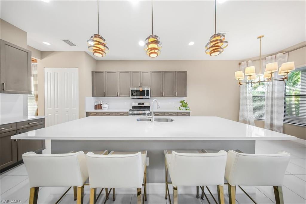 4036 Nova Lane Naples, FL 34119 - Photo 7 of 50 a view of a dining room with furniture