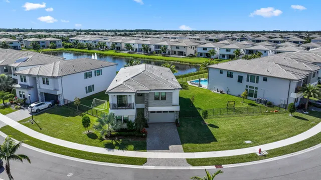 an aerial view of a house with a garden and plants