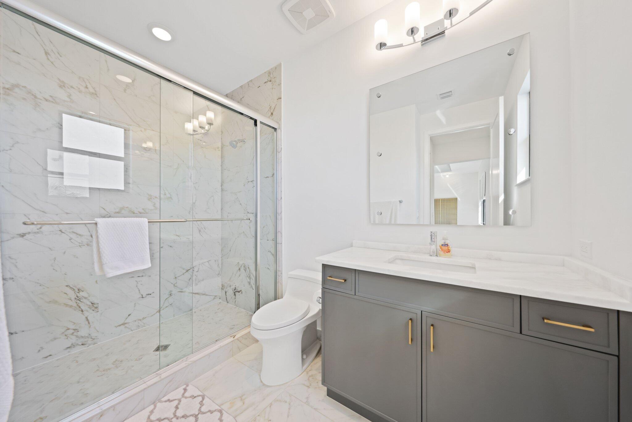 8116 Laurel Falls Drive Boca Raton, FL 33496 - Photo 34 of 81 a bathroom with a sink toilet a mirror and shower