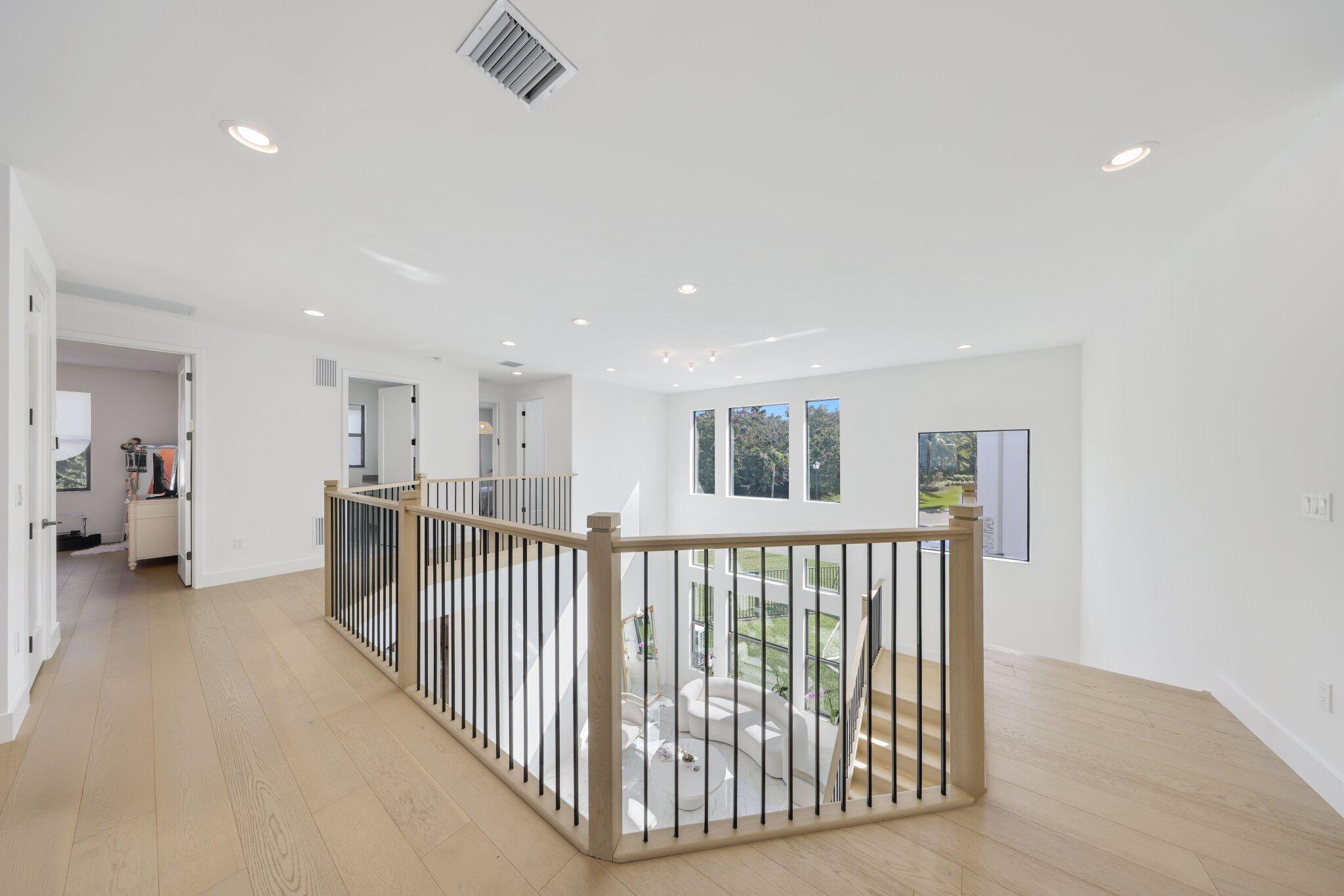 8116 Laurel Falls Drive Boca Raton, FL 33496 - Photo 40 of 81 a view of a hallway with workspace