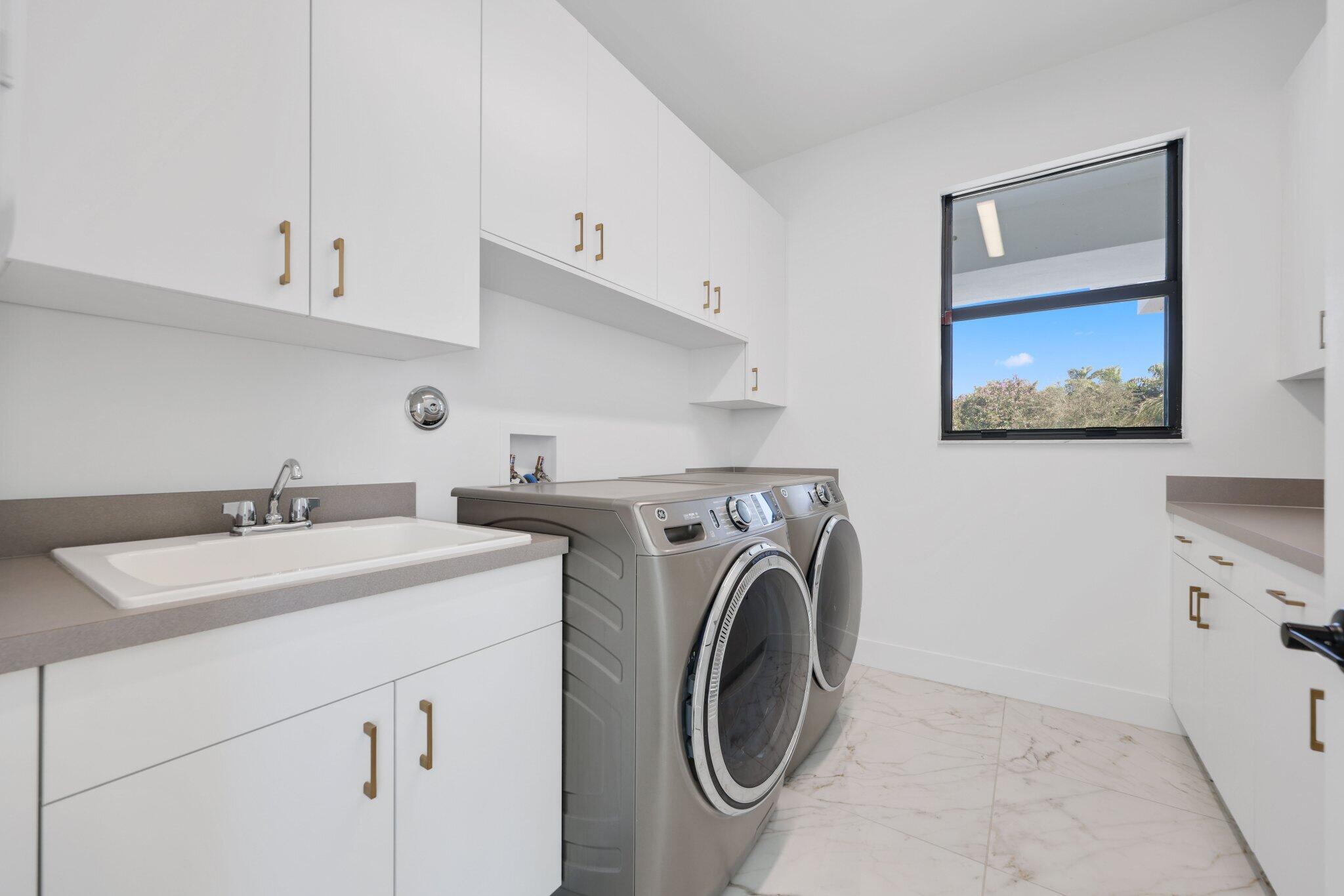 8116 Laurel Falls Drive Boca Raton, FL 33496 - Photo 41 of 81 a utility room with dryer and washer