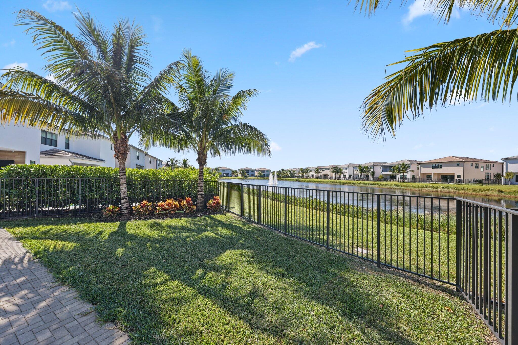 8116 Laurel Falls Drive Boca Raton, FL 33496 - Photo 52 of 81 a view of a backyard with a garden and swimming pool