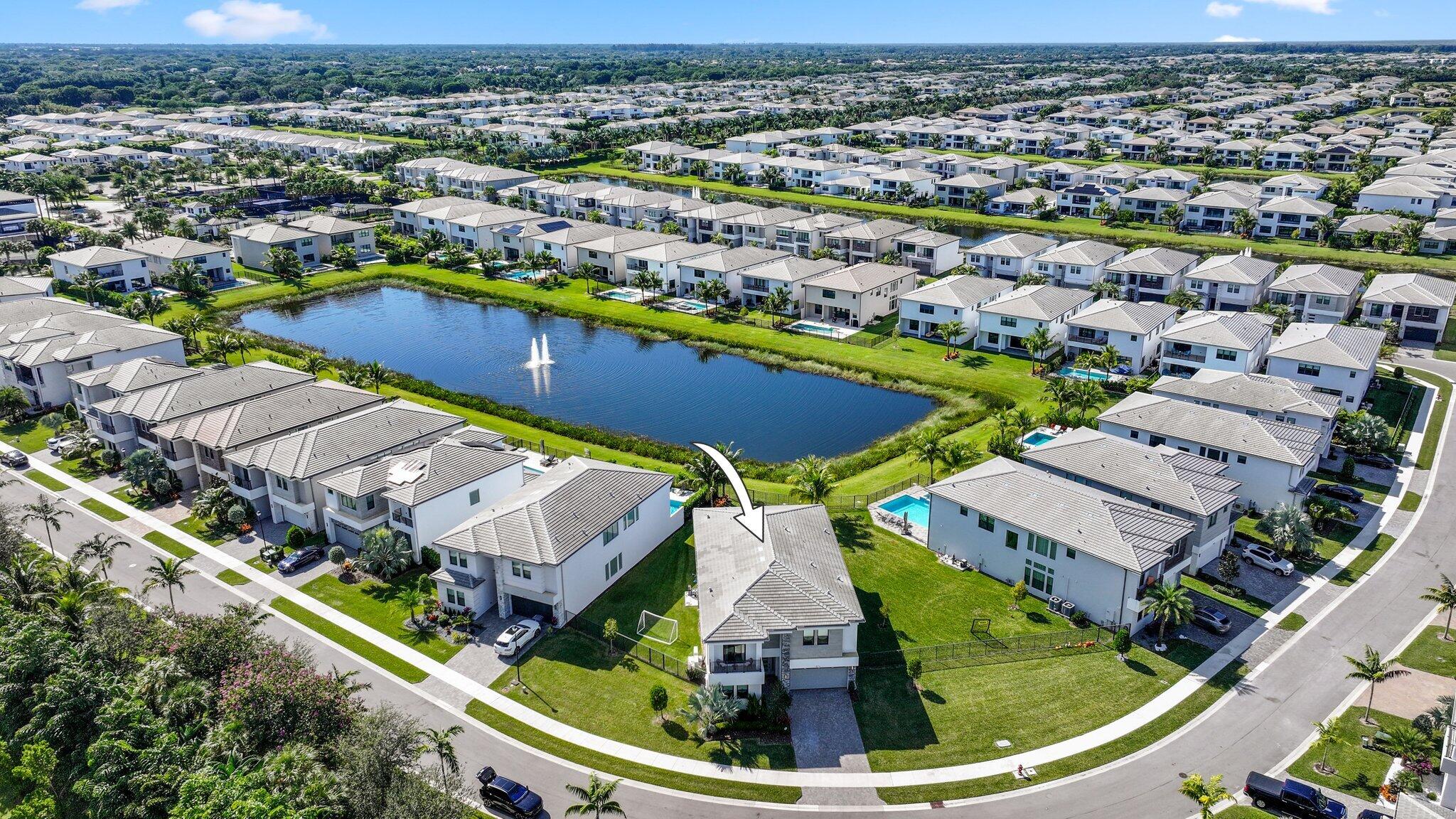 8116 Laurel Falls Drive Boca Raton, FL 33496 - Photo 60 of 81 an aerial view of a house with a swimming pool yard and outdoor seating