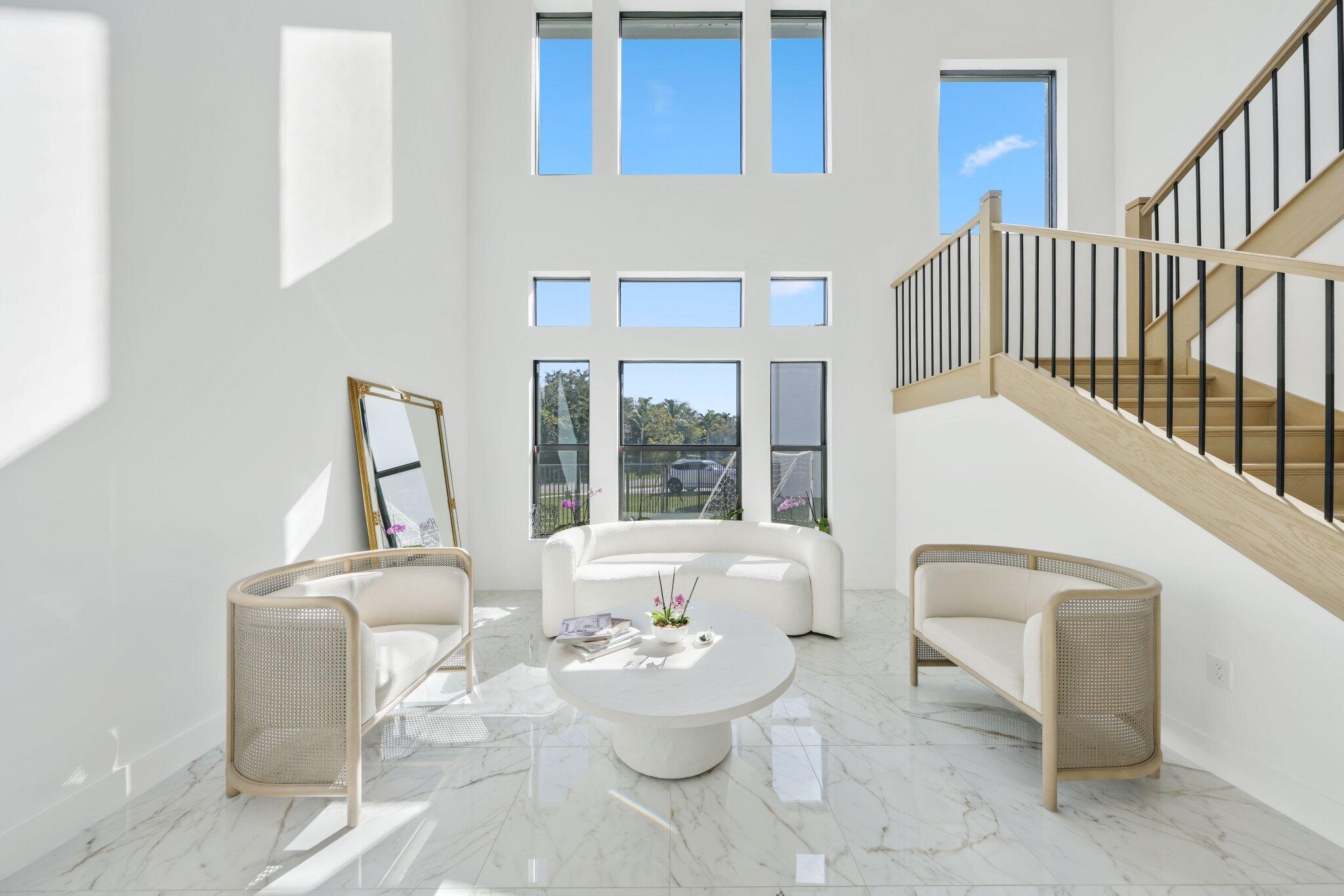 8116 Laurel Falls Drive Boca Raton, FL 33496 - Photo 8 of 81 a living room with furniture and a large window