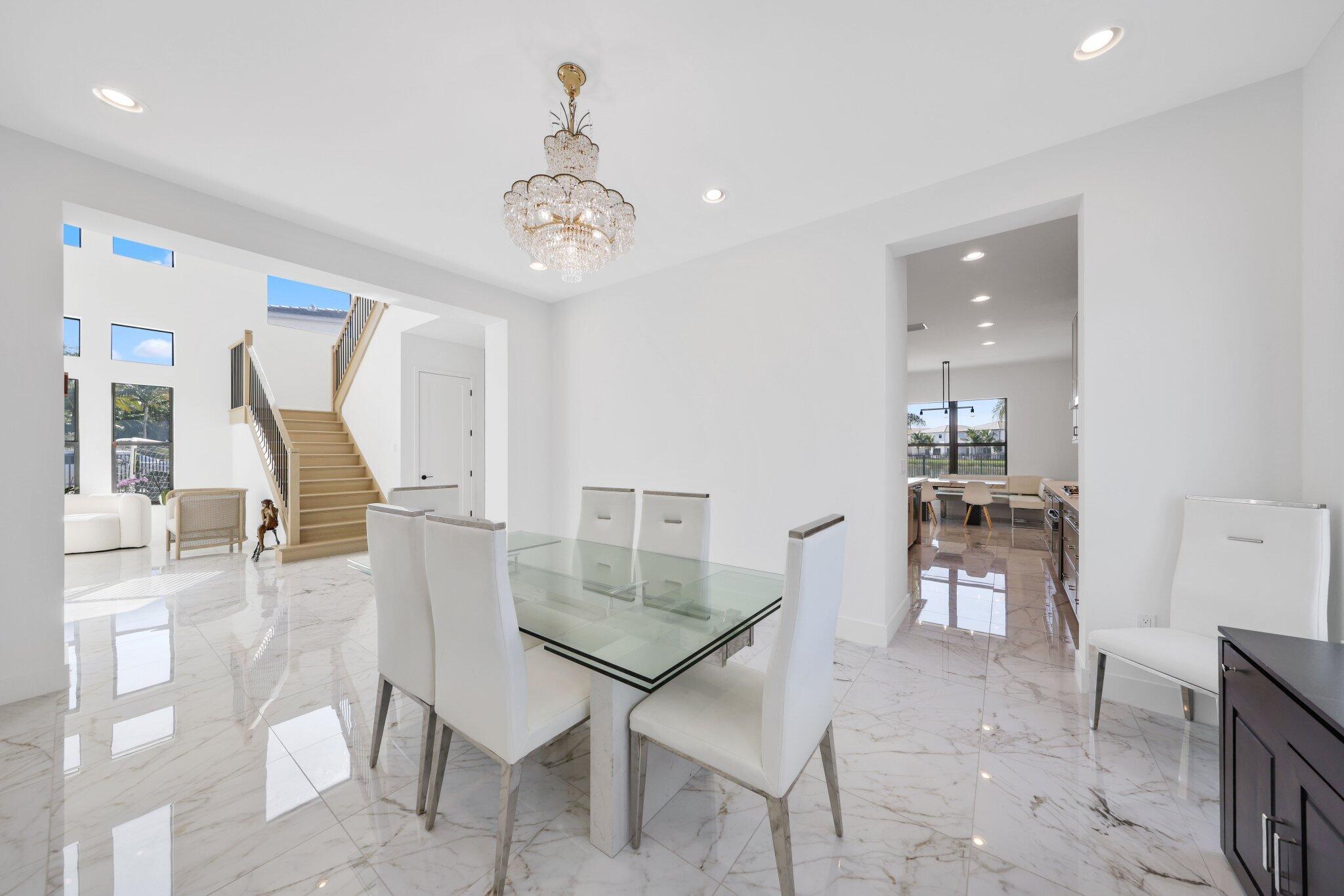 8116 Laurel Falls Drive Boca Raton, FL 33496 - Photo 10 of 81 a view of a dining room with furniture