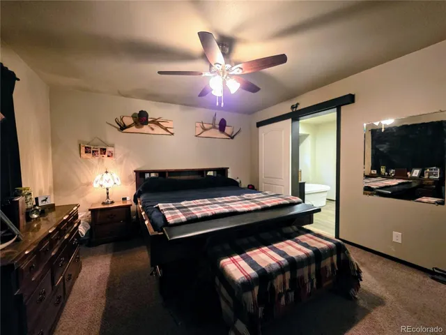 a room with a bed and a desk