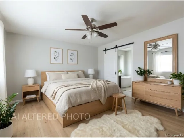 a spacious bathroom with a large mirror vanity and toilet