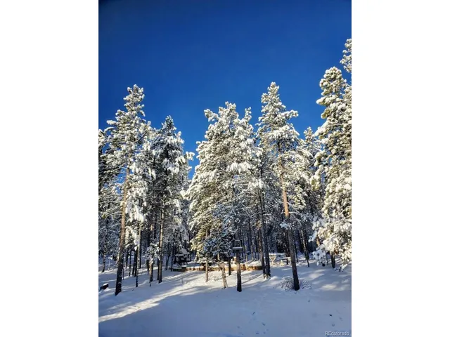 a sunset view with a lake